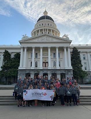 Patelco team members at the 信贷 Union for Kids Sactown Run event photo with the capitol in the background