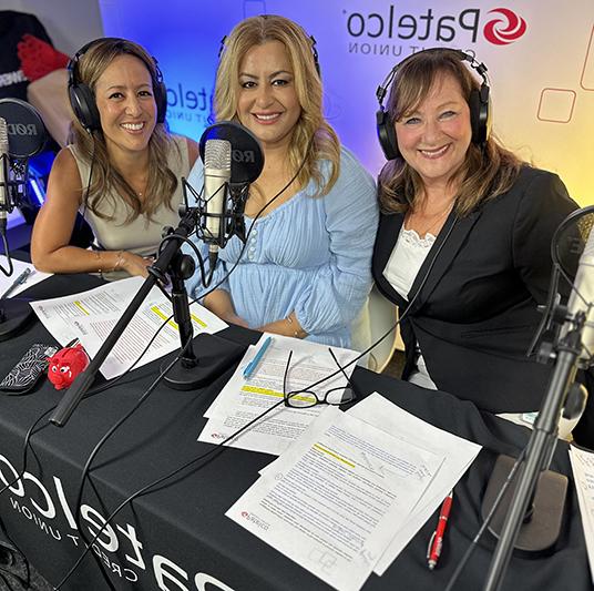 Patelco employees Michele Enriquez, Peggy Wyman, and Shaida Samimi at the podcast desk.